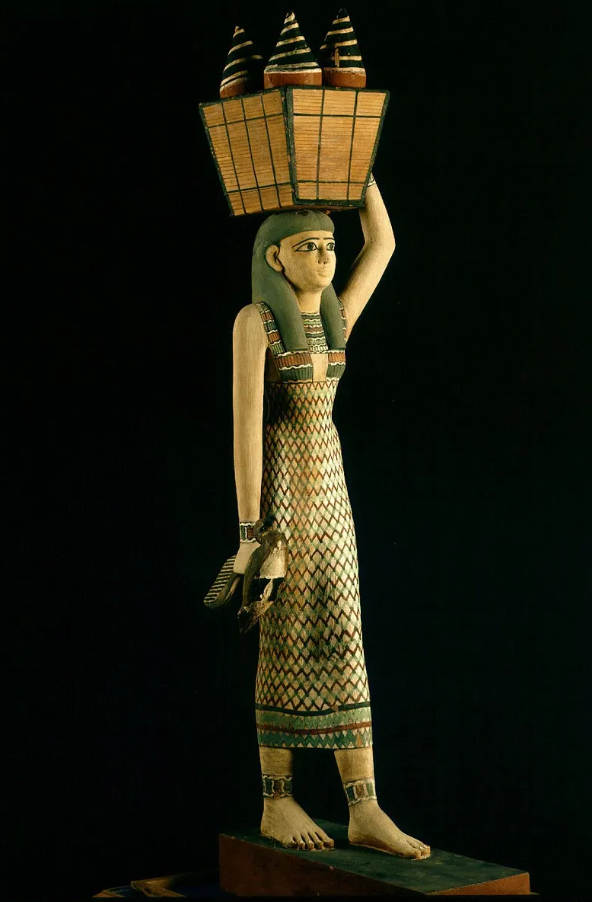 Statue of a woman carrying offerings. Egyptian Museum, Cairo. JE 46725