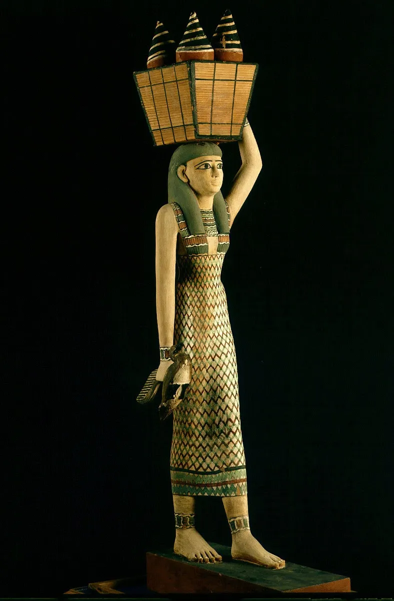 Statue of a woman carrying offerings, Circa 1981-1975 B.C., Middle Kingdom, Egypt, Egyptian Museum, Cairo. 